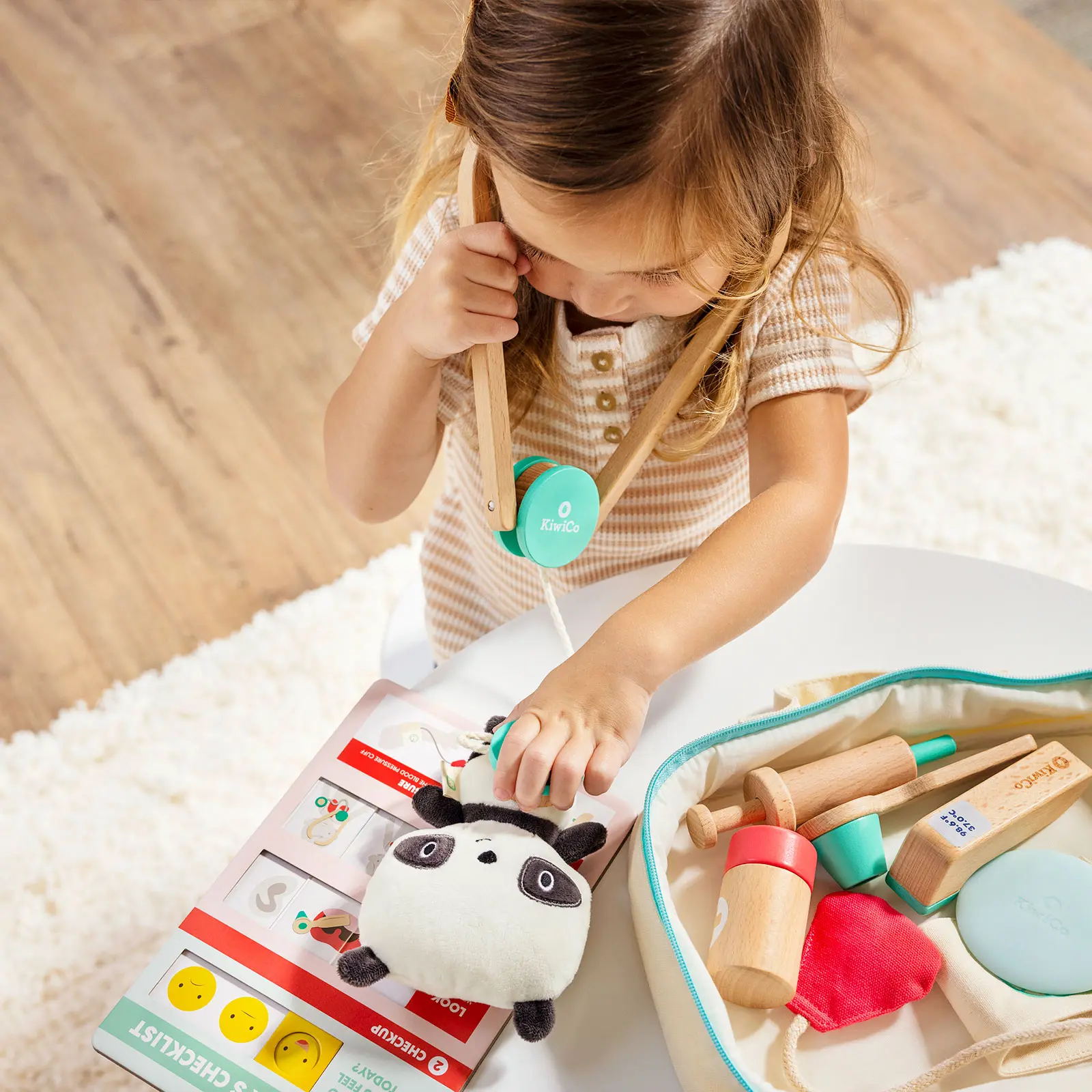 girl playing with stethoscope 